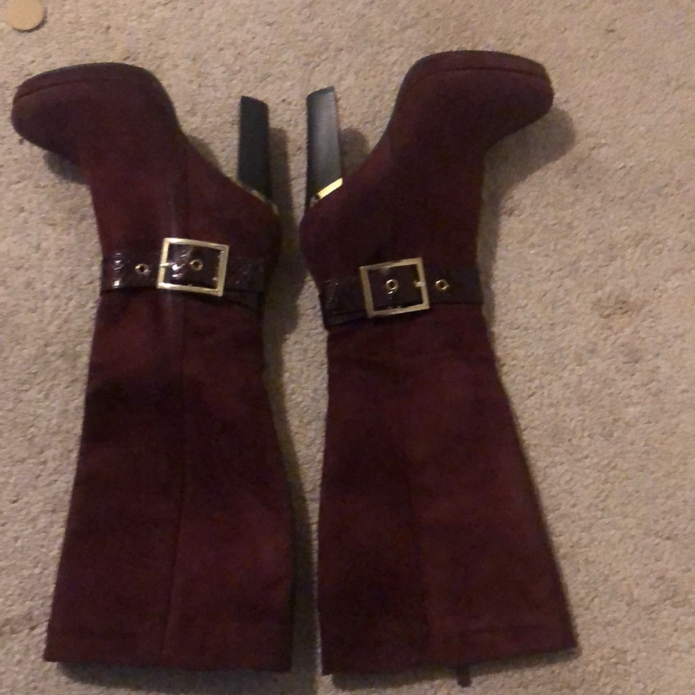 Burgundy boots with gold trip on heels. In very good condition, worn once